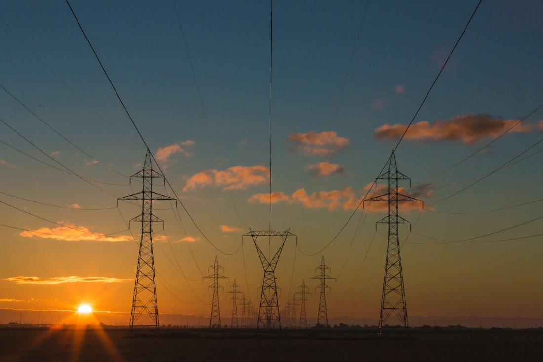 Electrical power pylons at sunset (illustrative image)
